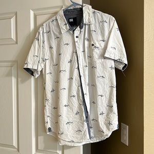 Men’s medium button down shirt with a pocket.  Shirt sleeve with Sharks on it